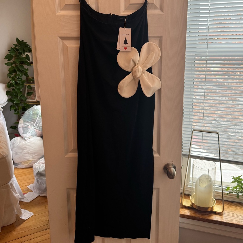 Elegant Black Dress with White Bow Accent